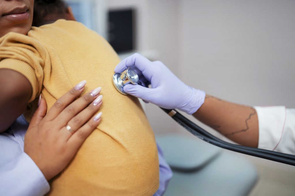 Baby and parent getting checked by Healthcare provider